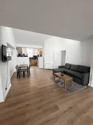 a living room with a couch and a table at Edinburgh elms for 4 - New Town - City Center EB8 in Edinburgh