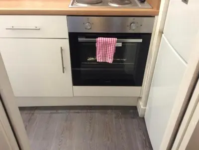 a kitchen with an oven with a towel on it at 103 NELSON STREET Aubery in Largs