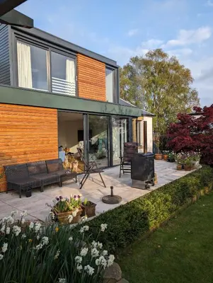 a house with a patio with a flat screen tv at Beautiful double room B&B great location homeshare Edinburgh in Edinburgh