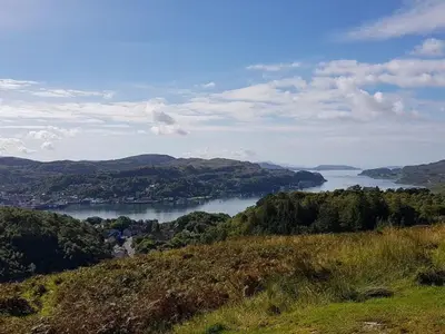 a view of a large body of water from a hill at Bay View in Oban