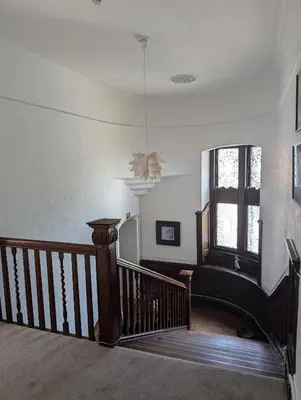 a room with a staircase and a ceiling at Garmoyle House & Garmoyle Mid Cottage in Dumbarton