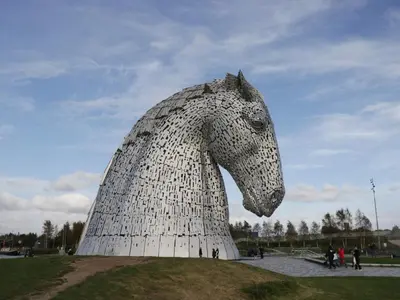 a statue of a horse on top of a field at Elm in Denny