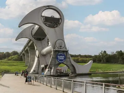 a large monument in front of a river at Ash in Denny