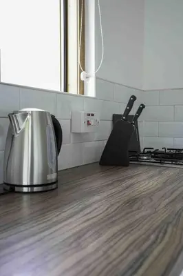 a kitchen with a toaster on a wooden counter top at Redding House in Falkirk