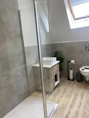 a bathroom with a shower with a sink and a toilet at 6 Smithhills - Sleeps 3 Central Excellent Transport Links Glasgow & Airport in Paisley