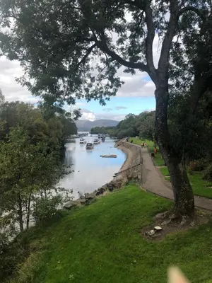 a view of a river with boats in it at Victorian Flat in Bonhill