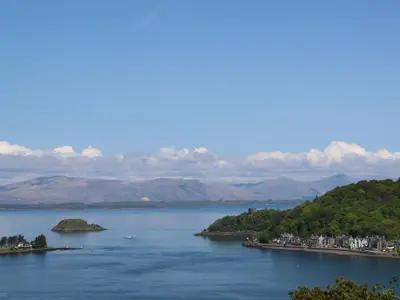 a view of a lake with mountains in the background at Seaview Lismore House in Oban