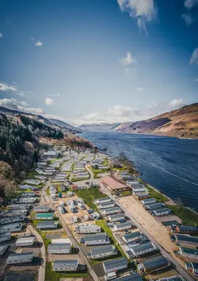 an aerial view of a river with boats at Loch Earn leisure park in Saint Fillans