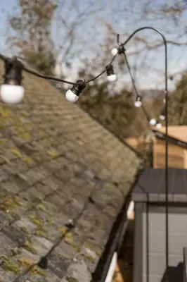 a street light with lights on top of a roof at Rosebank Cottage - Hot Tub & Log Stove in Alexandria