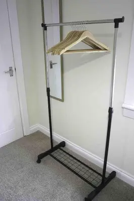 a mirror on a stand in a room at Scotia House in Larkhall