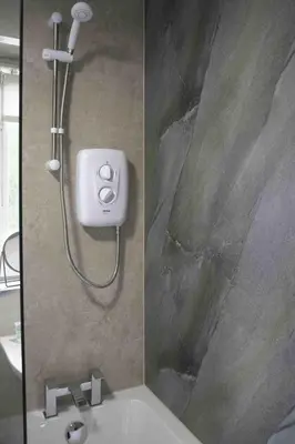 a bathroom with a shower and a sink at Scotia House in Larkhall