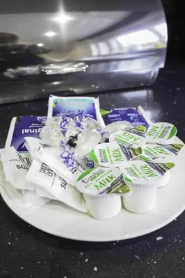 a white plate with toothpaste and toothbrushes at Scotia House in Larkhall