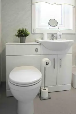a white bathroom with a toilet and a sink at Pentland House in Bathgate