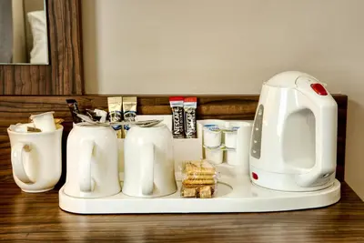 a counter with white appliances on a table at Queen of the Loch, Balloch by Marston's Inns in Balloch
