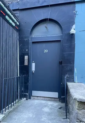 a blue door with the number on a building at Central Morrison Street Apartment in Edinburgh