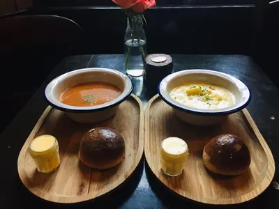 two bowls of soup and two buns on a tray at The Cross Keys in Kippen in Kippen