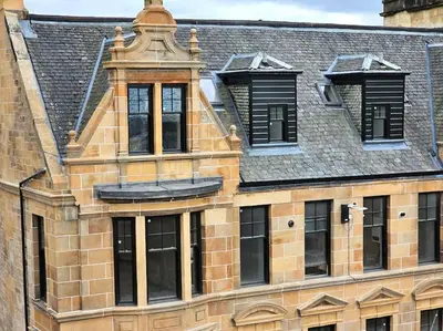 a brick building with windows and a roof at 4 Smithhills Central 2 bed sleeps 4 in Paisley