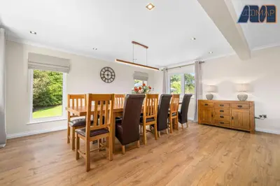 a dining room with a table and chairs at Large Family Home with Hot Tub or Jacuzzi, Log Burner in Bearsden