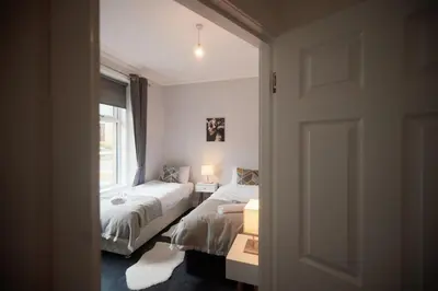a bedroom with two beds and a window at A stunning And Slick Escape in Stonehouse