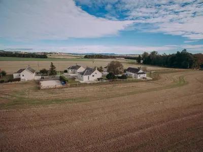 a farm with a field and houses in the distance at Lochy - Uk47884 in Keilour