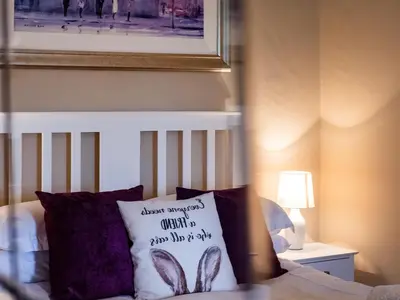 a bed with a pillow that says never sweep unless you have half of it at Lochy - Uk47884 in Keilour