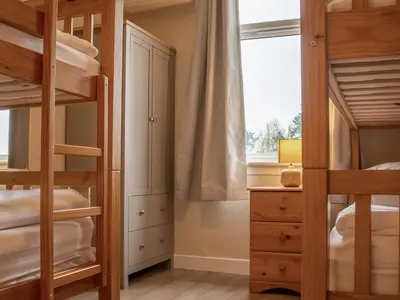 a bedroom with bunk beds and a window at Ninetrees - Uk47883 in Keilour