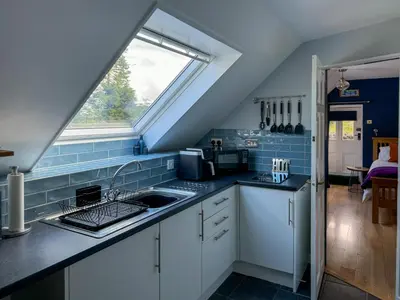 a kitchen with a sink and a window at The Coach House Knipoch in Oban