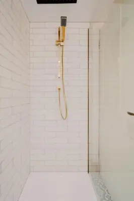 a bathroom with a shower with a shower head at Number Twenty Seven luxury apartment, Aberdour, Fife in Aberdour