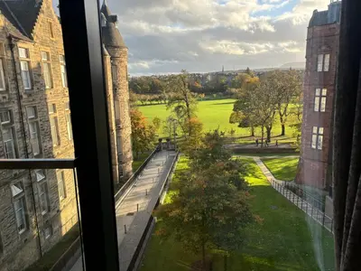 a view from the window of a building at Executive Quartermile apartment near to Castle University with park view in Edinburgh