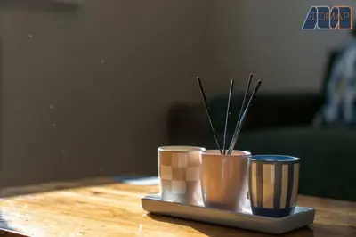 two cups on a table with sticks in them at Elegant 2Bed Sleeps 4 With Parking in Paisley