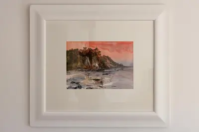 a painting in a white frame on a wall at The Stables at Brickrow Farm in Ayr
