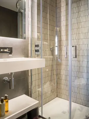 a shower with a glass door in a bathroom at Arran Shores Luxury Shorefront Apartment 5 in Lamlash