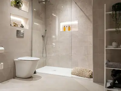 a bathroom with a shower and a toilet in it at Arran Shores Luxury Shorefront Garden Terrace Apartment 6 in Lamlash