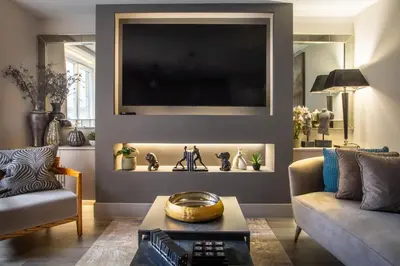 a living room with a couch and a tv at Arran Shores Luxury Shorefront Apartment 8 in Lamlash