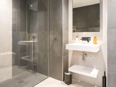 a bathroom with a shower and a sink at Arran Shores Luxury Shorefront Penthouse Suite 10 in Lamlash