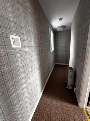 a hallway with a room with a tile wall at Thornhill cottage with views of the Trossachs in Thornhill