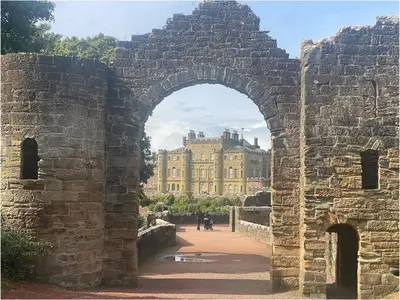 an old stone archway with a building in the background at The Wee Sprout in Stranraer