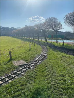 a train track in the middle of a field at The Wee Sprout in Stranraer