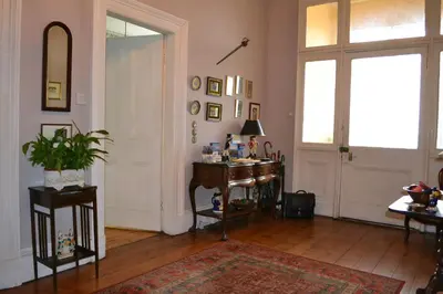 a room with a desk and a window and a door at Maybank Guest House in Helensburgh