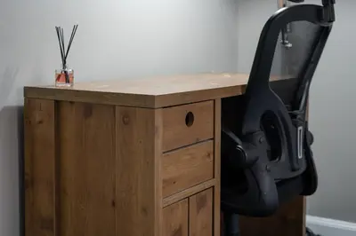 a wooden desk with a chair next to it at 2-Bed Flat Wishaw Free Parking Family-Friendly in Wishaw