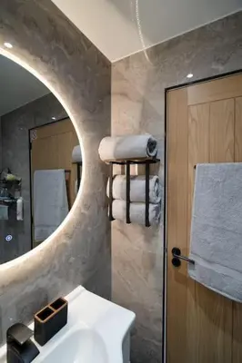 a bathroom with a sink and a mirror at The Pad in Paisley