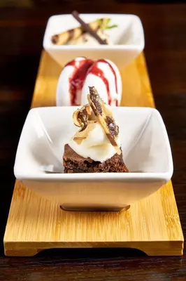 a plate with a piece of dessert on a table at Helix Hotel in Grangemouth