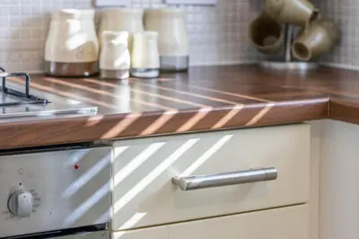 a kitchen with a counter top and a stove at Lena House in Glasgow