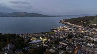 an aerial view of a city with a body of water at Castle Street Apartments - Luxury Ettrick Apartment in Rothesay