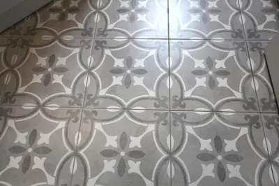 a close up of a tile pattern on a wall at Three Bedroom Upper Flat in Jordanhill in Glasgow