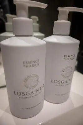 two white bottles of hygiene products sitting on a counter at Stunning 3 Bed Penthouse in West End in Glasgow