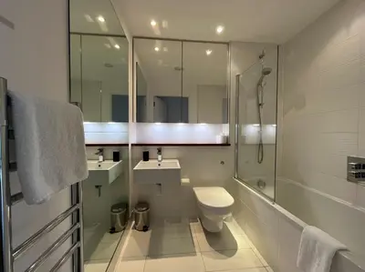 a bathroom with a toilet and a sink and a shower at Stylish Newly Decorated 2 Bed in Glasgow