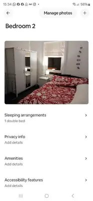 a screenshot of a room with a bed and a refrigerator at Garden homely house in Cardonald