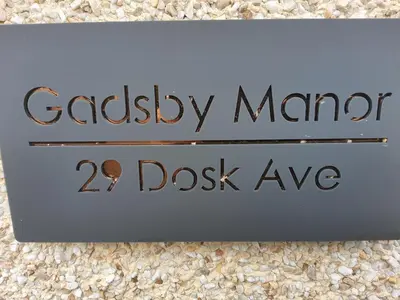 a sign for a dressagency manor dssave at Gadsby manor in Drumchapel