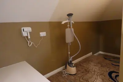 a room with a blow dryer in the corner of a room at Kelpies Hotel Falkirk in Falkirk